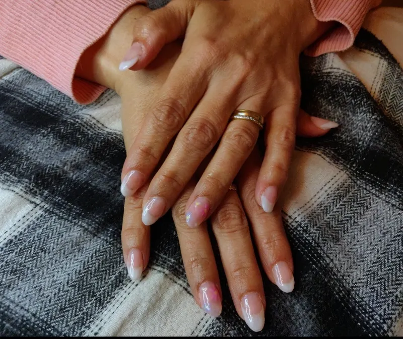 Almond, thick french tip with flower design on one nail